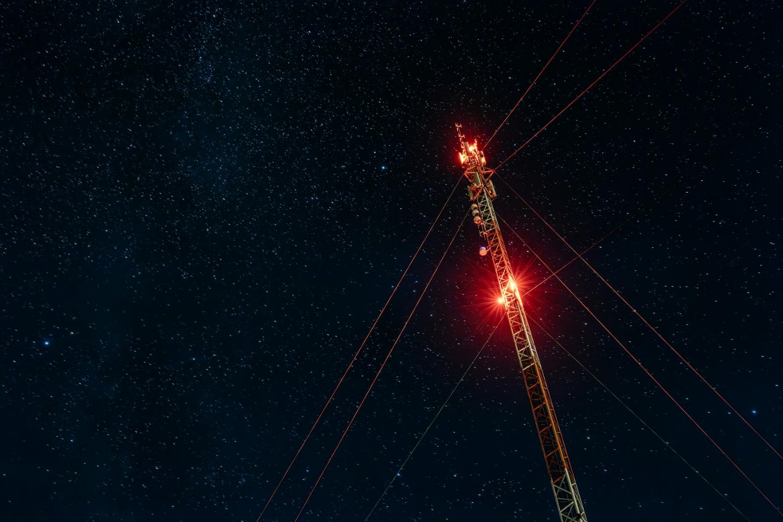 Cell tower against a starry night sky